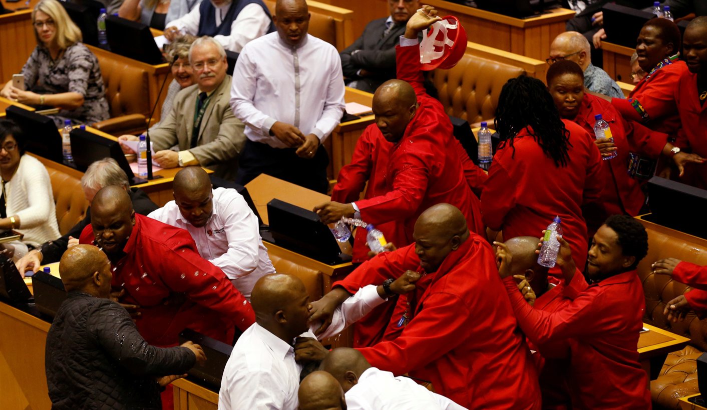 Party leader Julius Malema and members of his Economic Freedom Fighters (EFF) clash with Parliamentary security as they are evicted from the chamber in Cape Town, South Africa