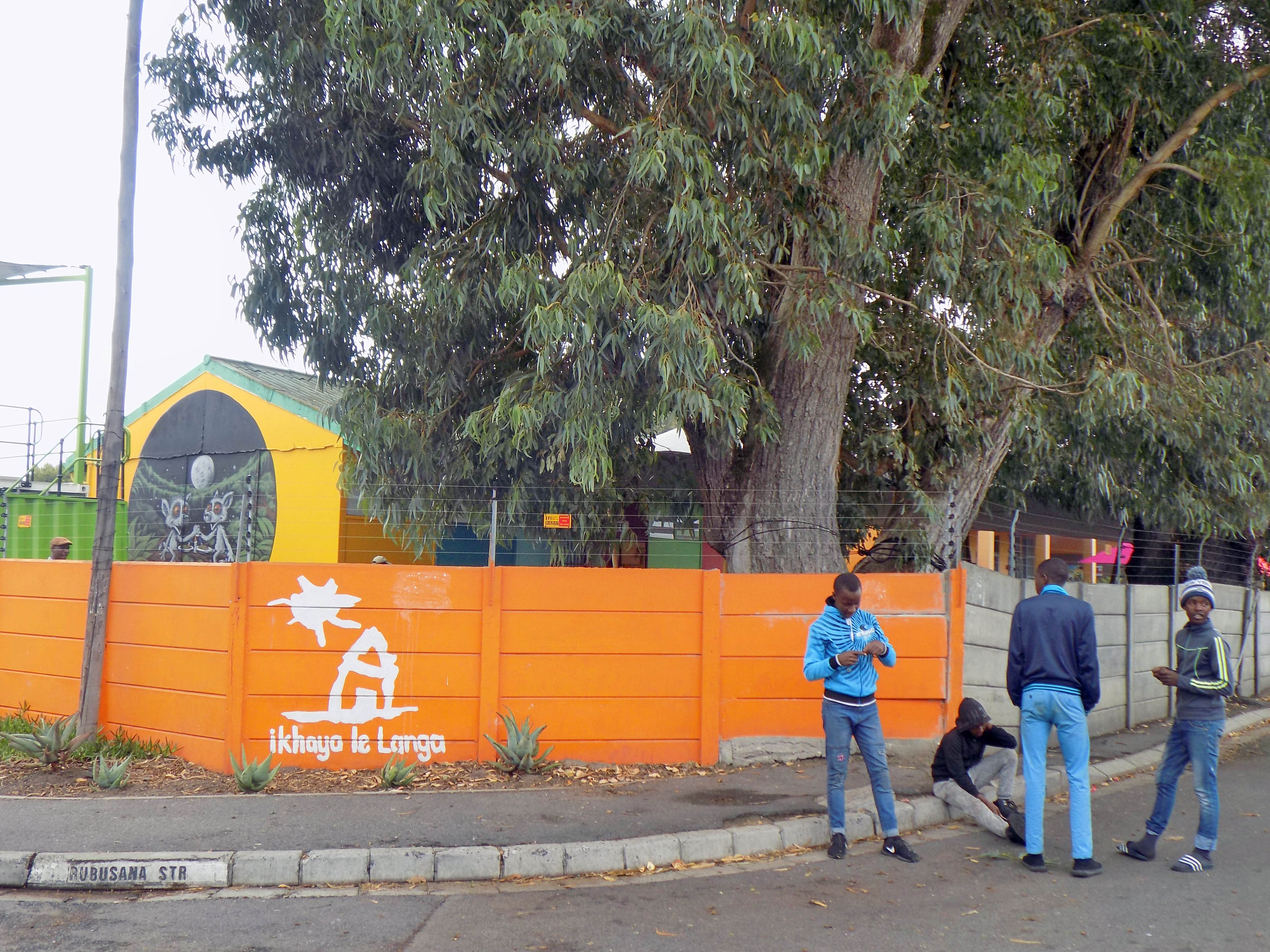 Young boys gather at the corner of the street of Ikhaya Le Langa