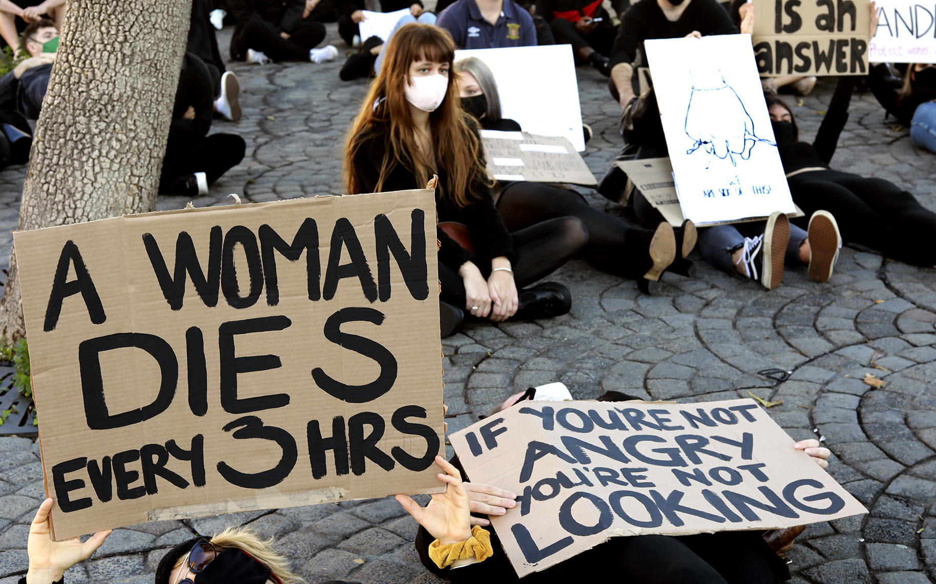 Gender-based violence protesters march outside Parliament in Cape Town