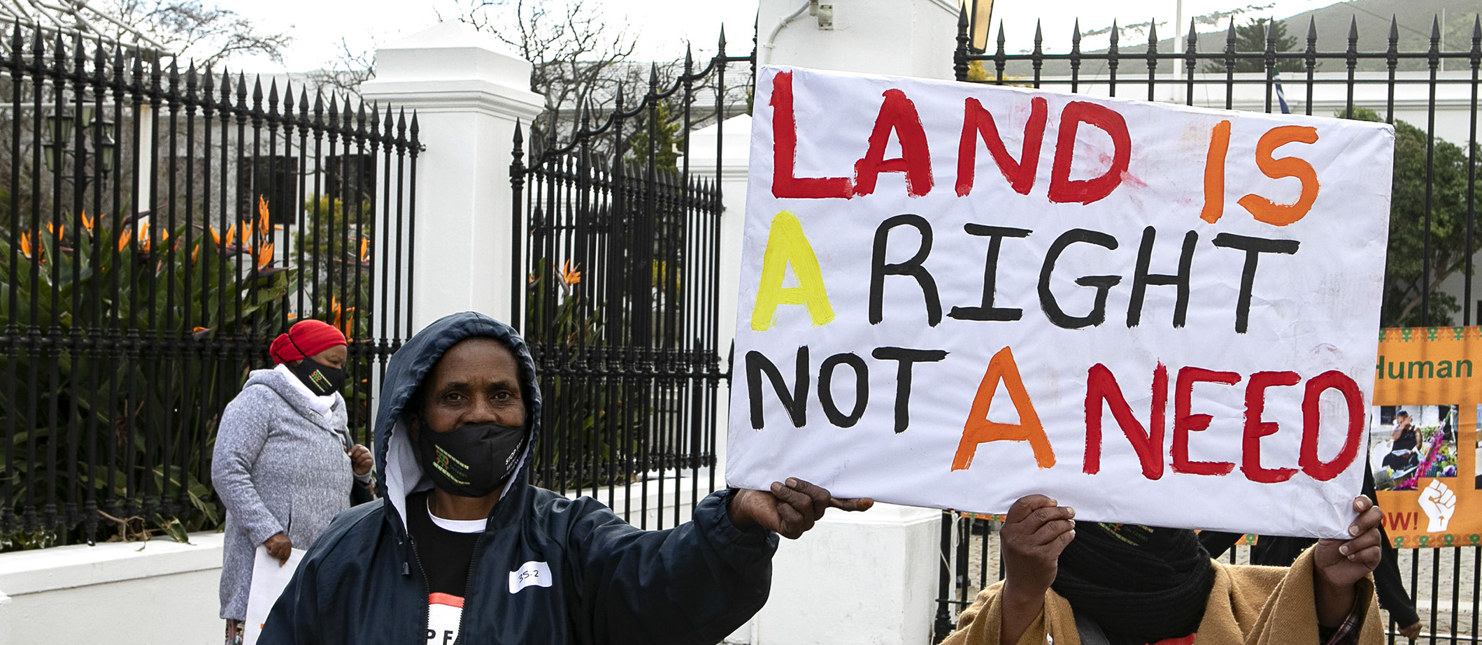 A group of women protest against the evictions of farm workers at Parliament in Cape Town