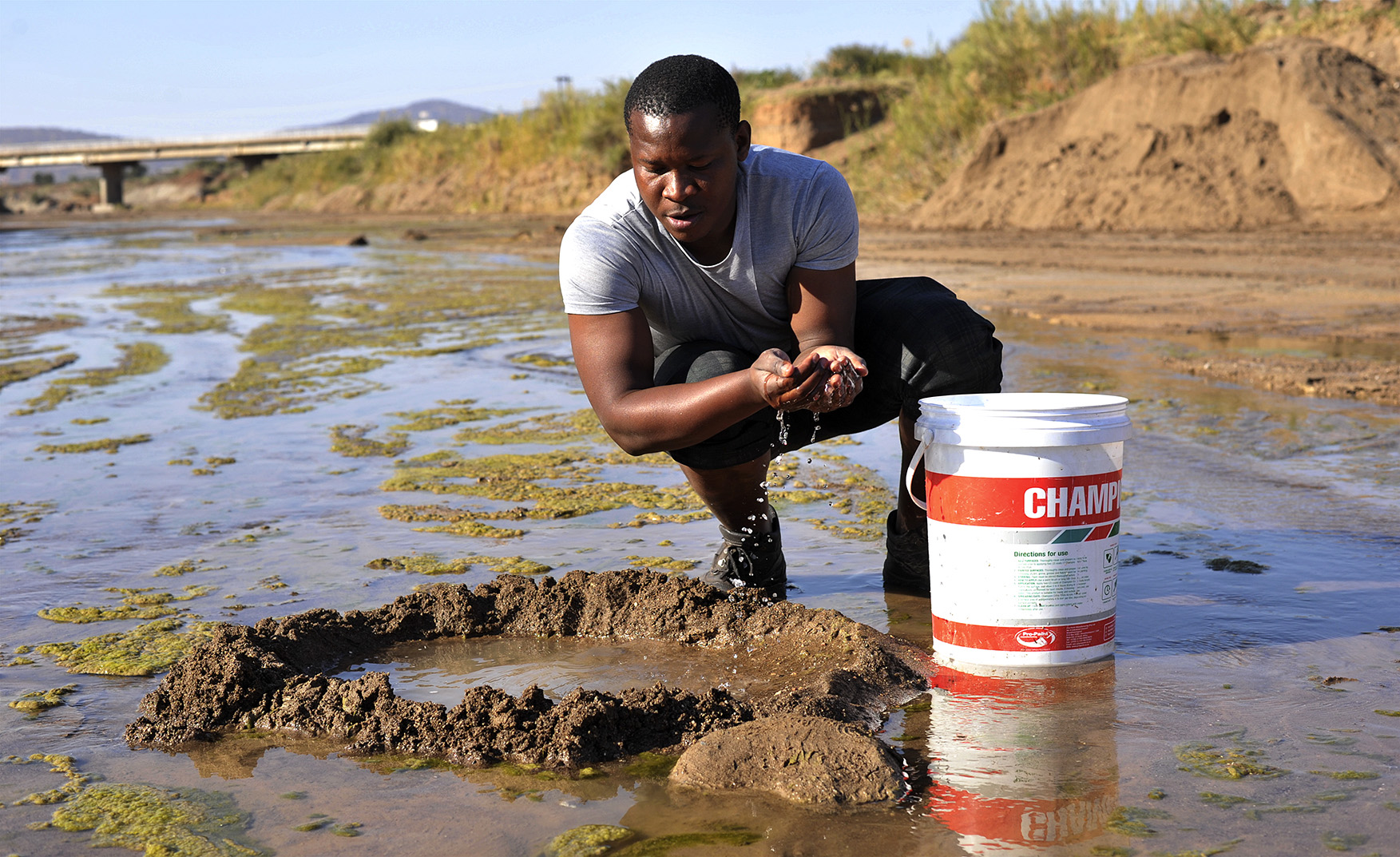Villagers forced to scrape the earth for water