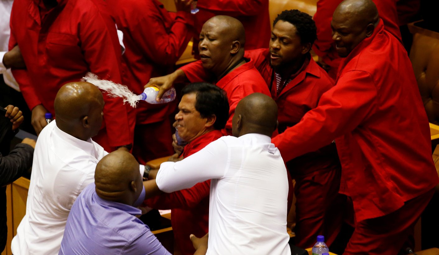 Party leader Julius Malema and members of his Economic Freedom Fighters (EFF) clash with Parliamentary security as they are evicted from the chamber in Cape Town, South Africa