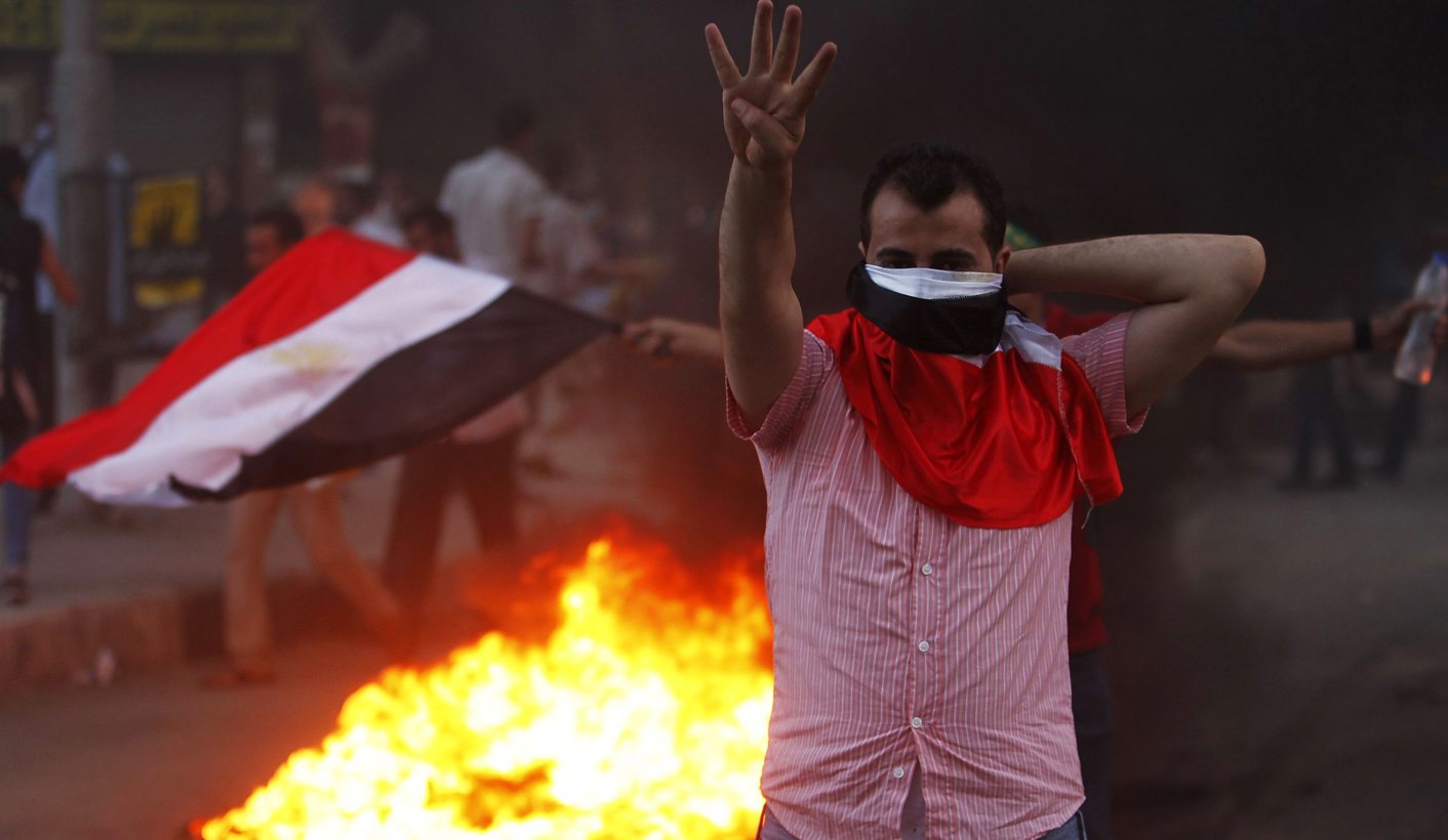 Egypt sends Mursi to trial as new constitution advances