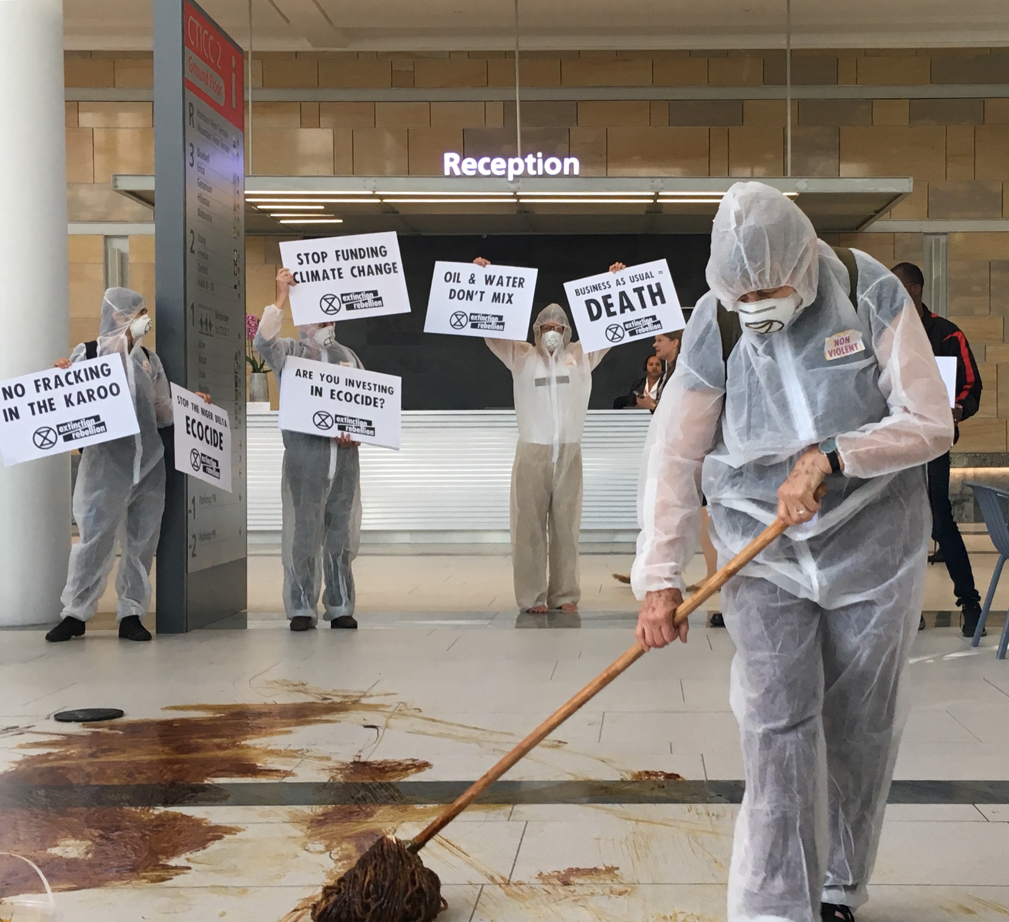 ‘Climate criminals, we’re watching you,’ chant anti-fossil fuel protesters