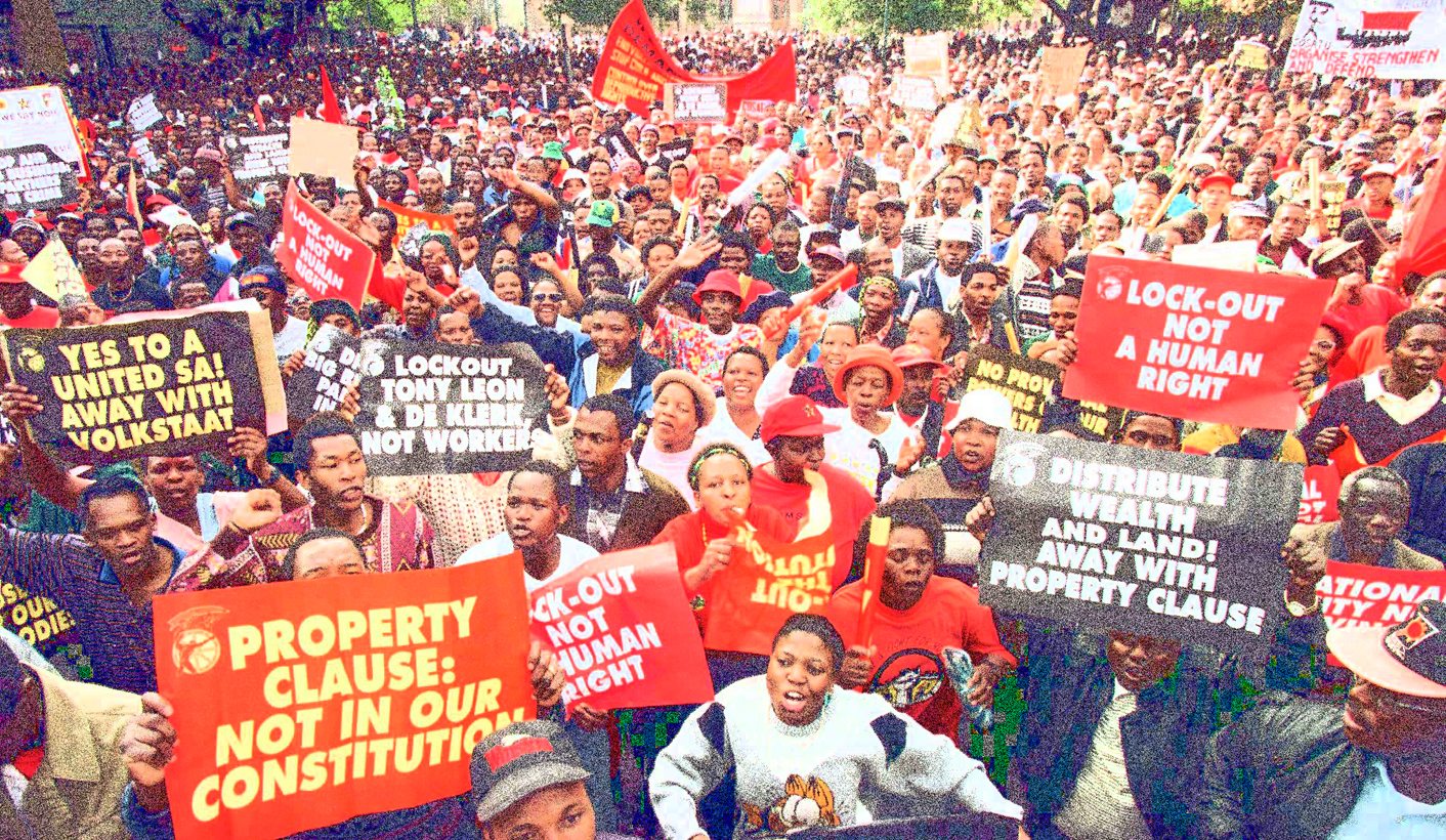 Striking members of South Africa's main union federation (COSATU) take to the streets in the commerc..
