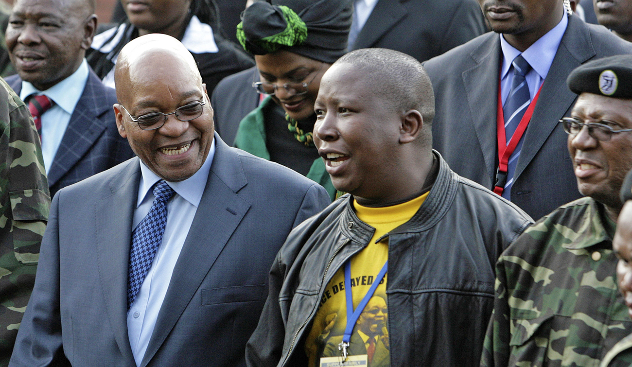 Zuma, leader of South Africa's ruling ANC, chats with Malema, president of ANCYL, at the Pietermaritzburg high court outside Durban