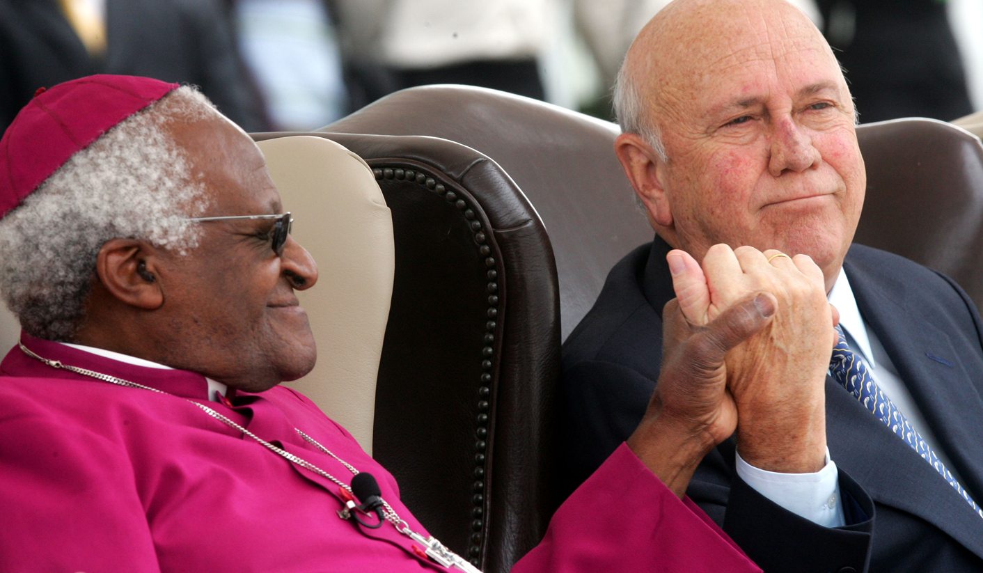 Archbishop Tutu clasps hand of former South African President de Klerk at ceremony in Cape Town