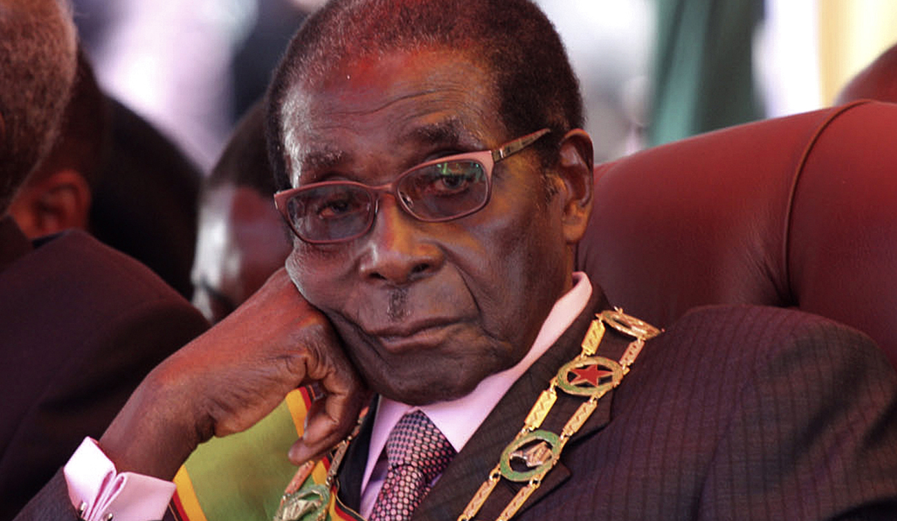 Zimbabwe's President Mugabe looks on during a rally marking Zimbabwe's 32nd independence anniversary celebrations in Harare