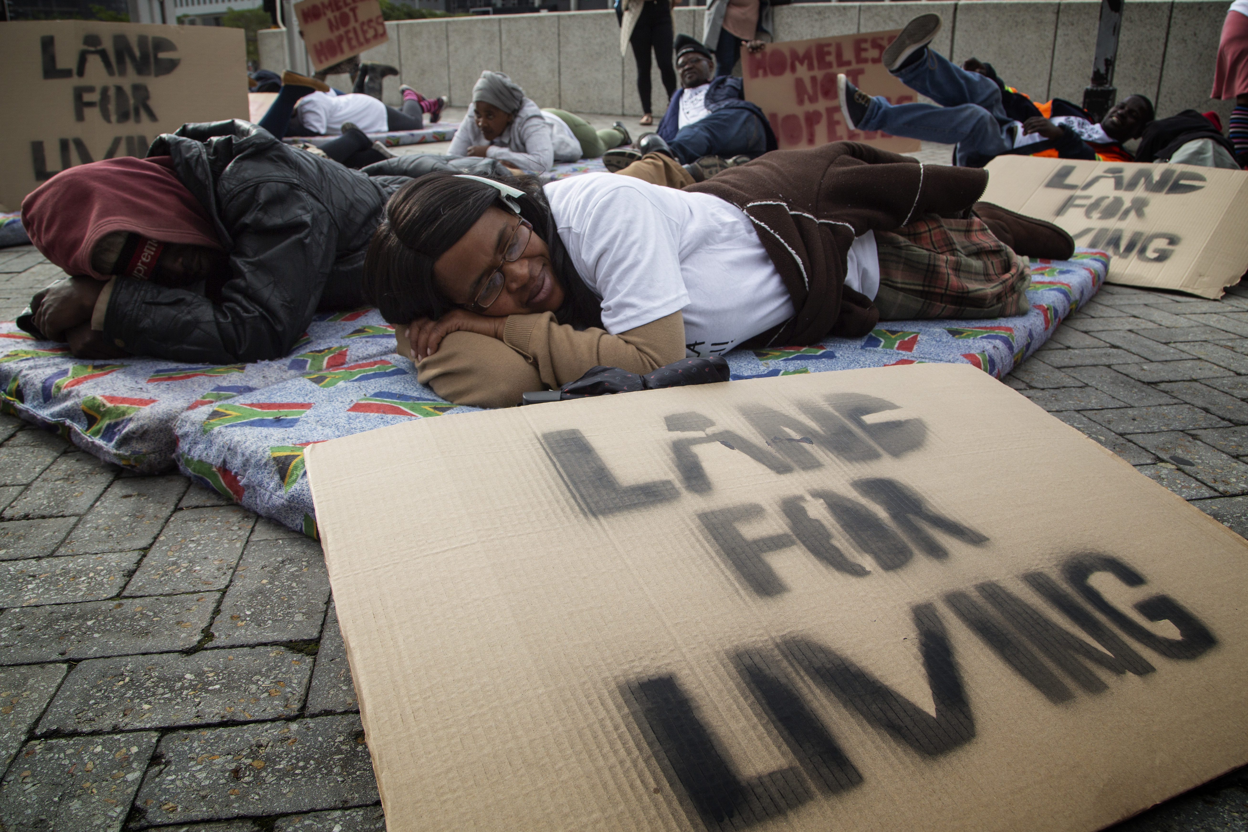 Protesters defy rain to demand homes as winter closes in