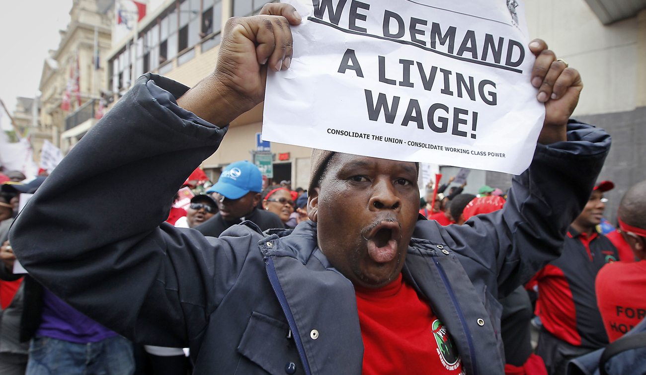 Striking South African public service workers march through the streets of Cape Town