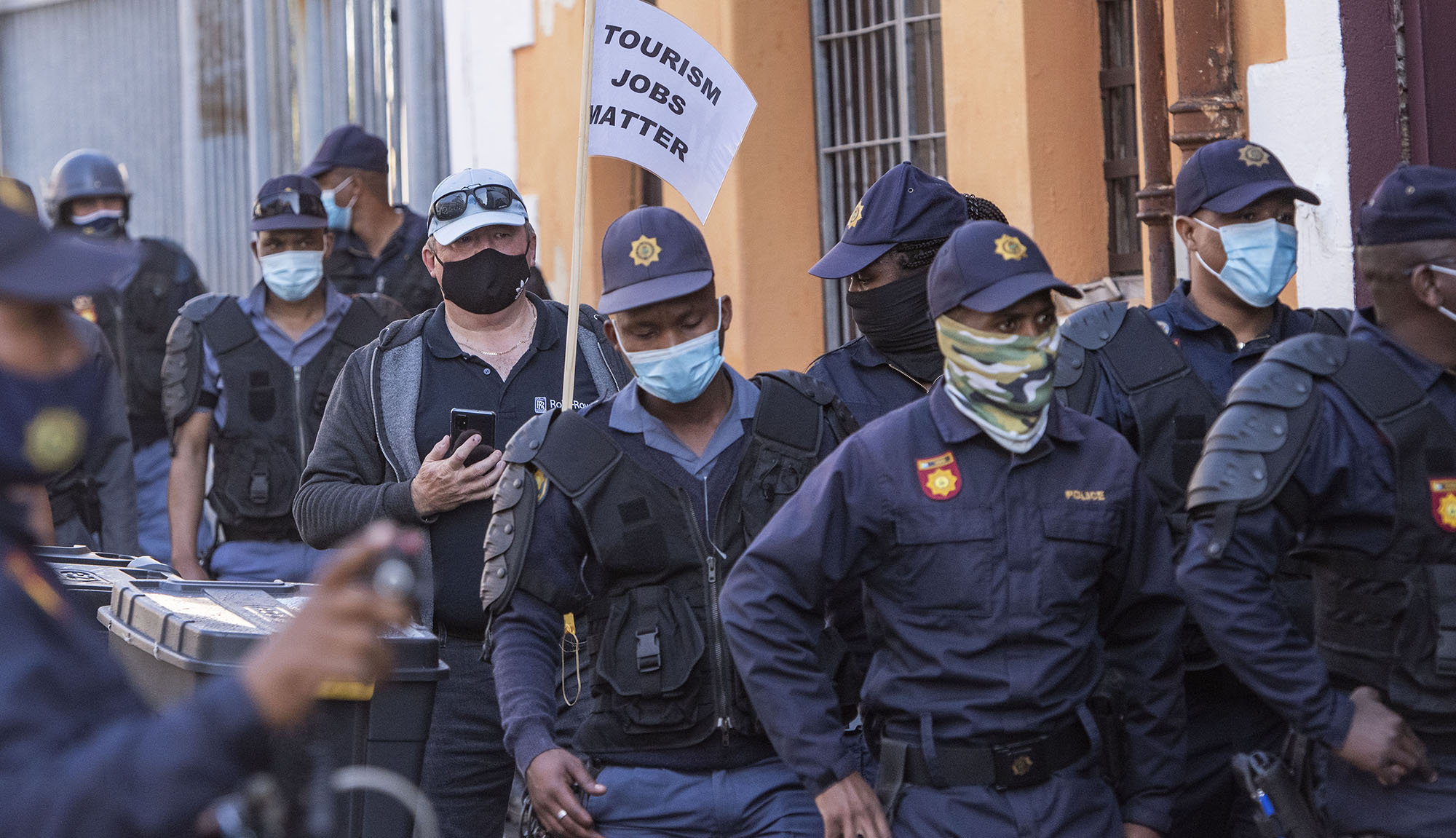 #ServeUsPlease protesters dispersed with water cannons and stun grenades