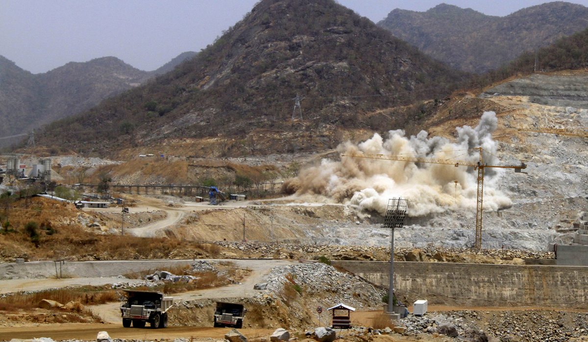 A cloud of dust rises from a dynamite blast, as part of construction work, at Ethiopia's Grand Renaissance Dam during a media tour along the river Nile in Benishangul Gumuz Region, Guba Woreda, in Ethiopia