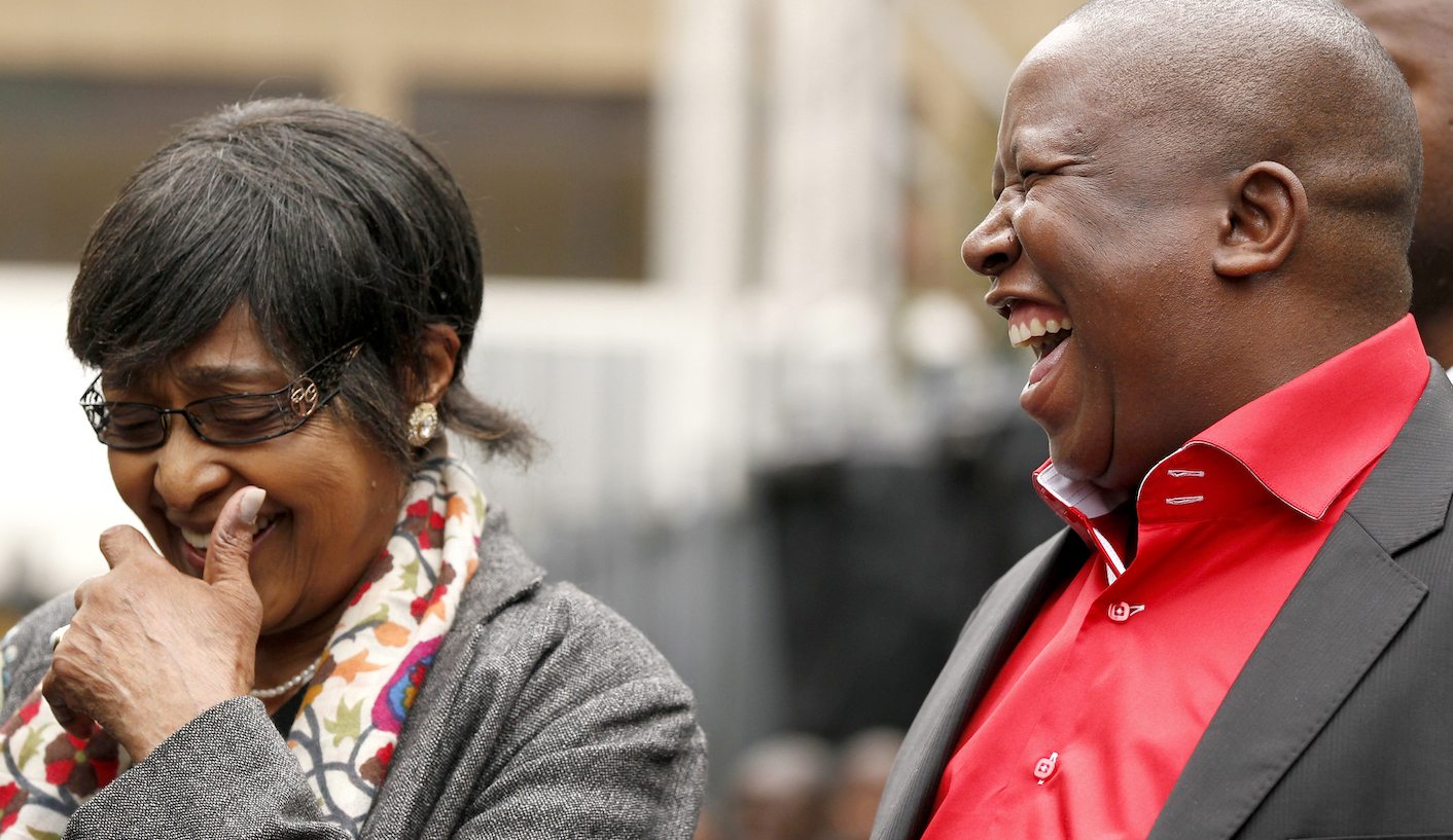 African National Congress Youth League president Julius Malema shares a joke with Winnie Madikizela-Mandela, former wife of Nelson Mandela, during Malema's appearance at the Johannesburg court