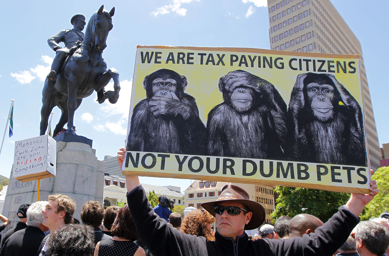 A demonstrator protests against the passing of the Protection of Information Bill outside parliament in Cape Town