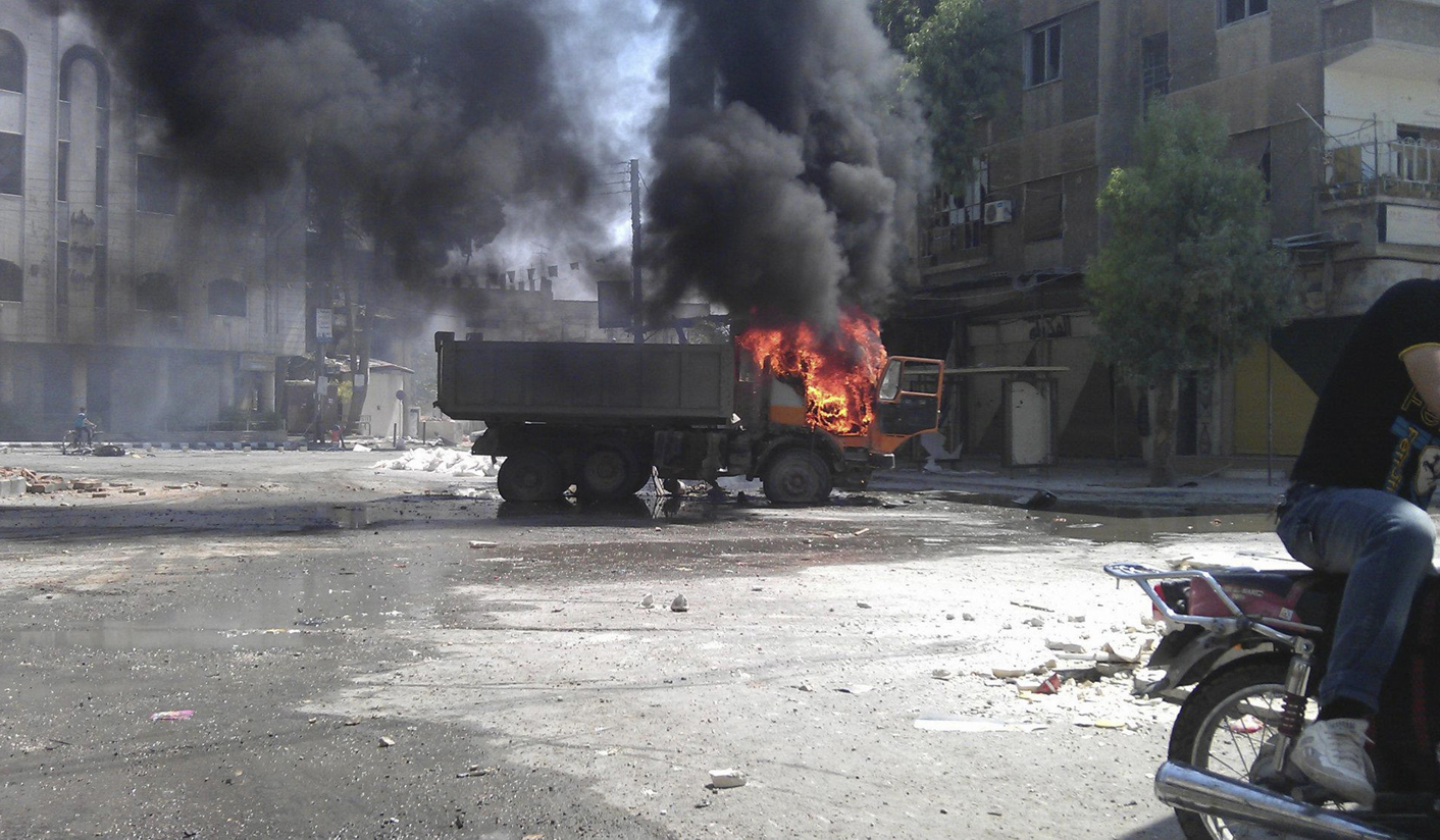 Syria says it could use chemical arms against foreign intervention