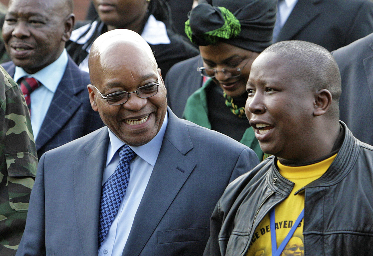 Zuma, leader of South Africa's ruling ANC, chats with Malema, president of ANCYL, at the Pietermaritzburg high court outside Durban