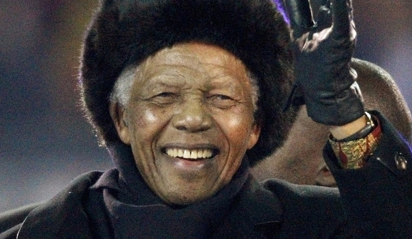 Former South African President Mandela waves to crowd at Soccer City stadium during the closing ceremony for the 2010 World Cup in Johannesburg