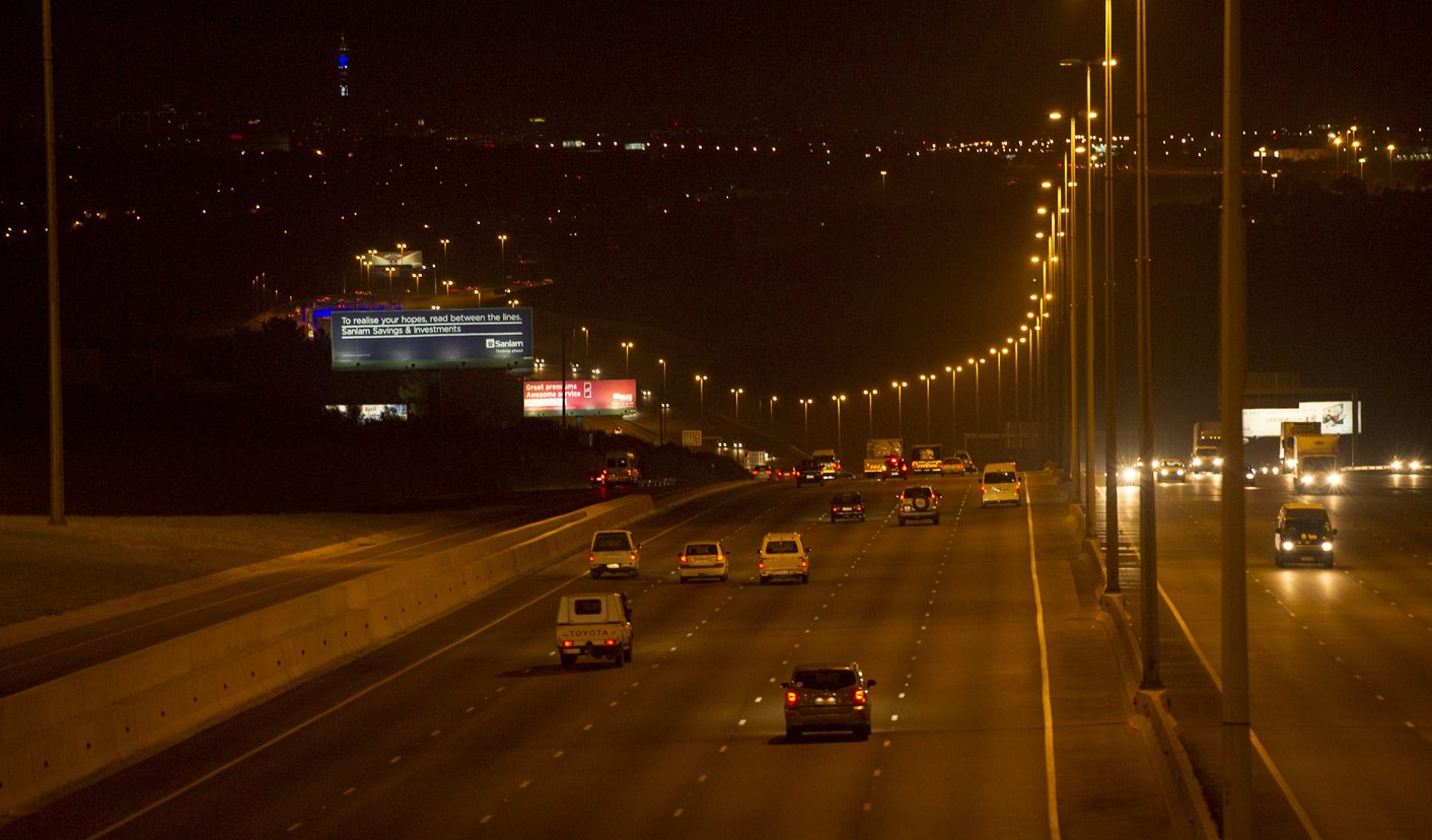 The N1 highway between Johannesburg and Pretoria, dawn. Greg Marinovich