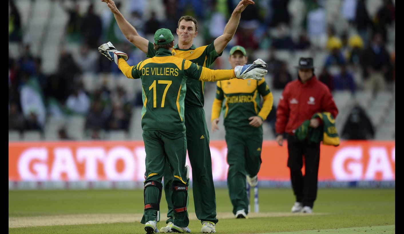 South Africa's McLaren celebrates with de Villiers after their team defeated Pakistan in the ICC Champions Trophy group B match at Edgbaston cricket ground in Birmingham
