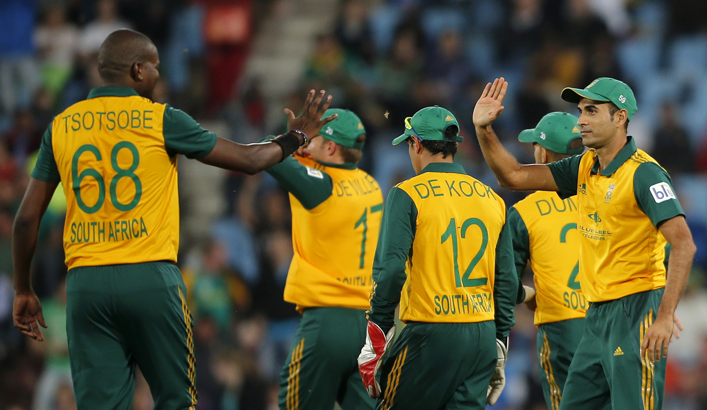 South Africa's cricket players celebrate the dismissal of Australia's Cameron white who was caught out by Imran Tahir during the final of the T20 cricket test match in Centurion