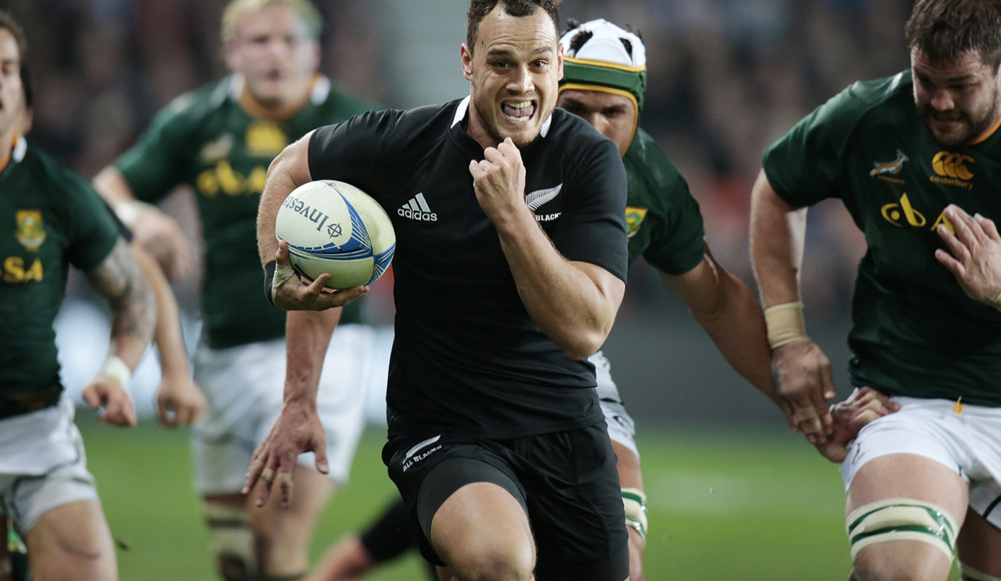 All Blacks' Dagg runs away from Springboks players during their Rugby Championship test match in Dunedin