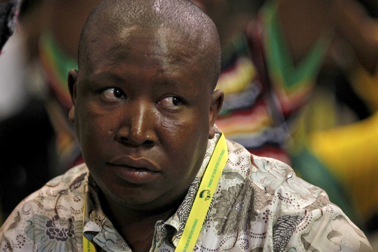 African National Congress Youth League leader Julius Malema listens as South Africa's President Jacob Zuma speaks in Durban