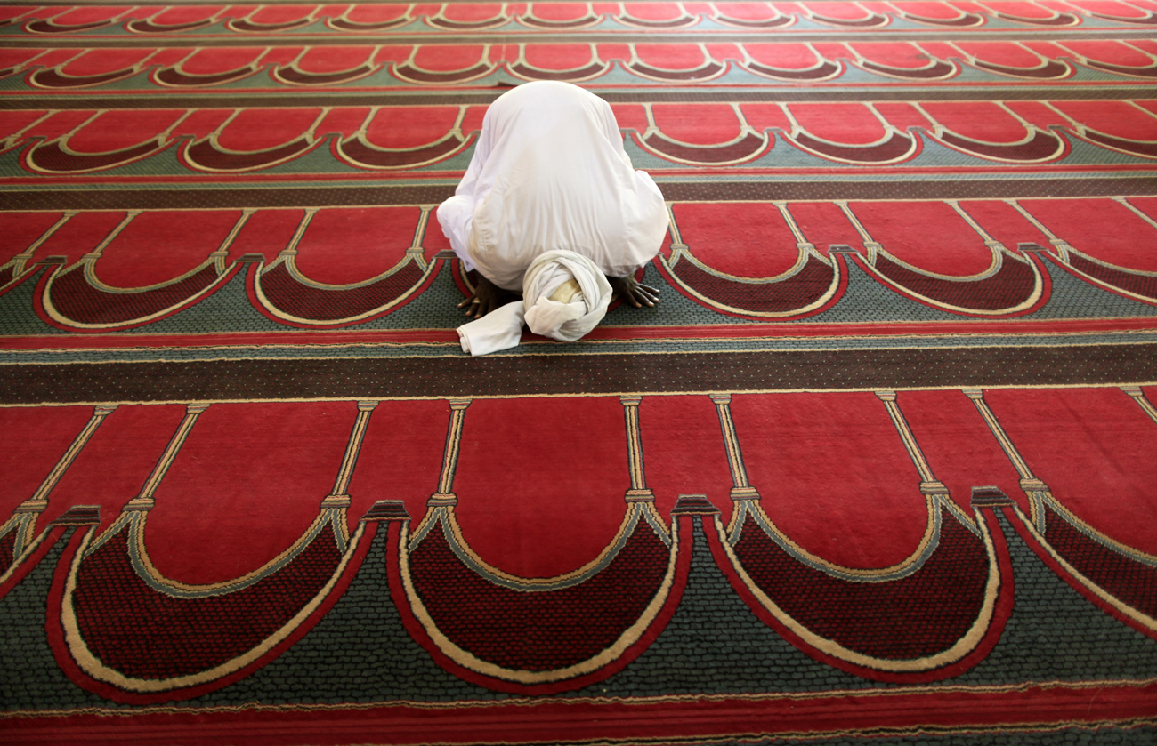 A Muslim Sudanese performs Friday prayers at Al Faroq mosque in Khartoum