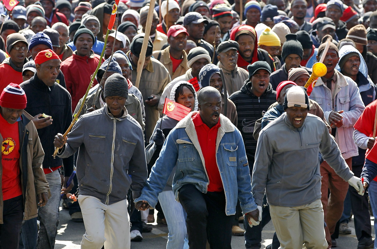 Workers take part in a march in the city of Johannesburg