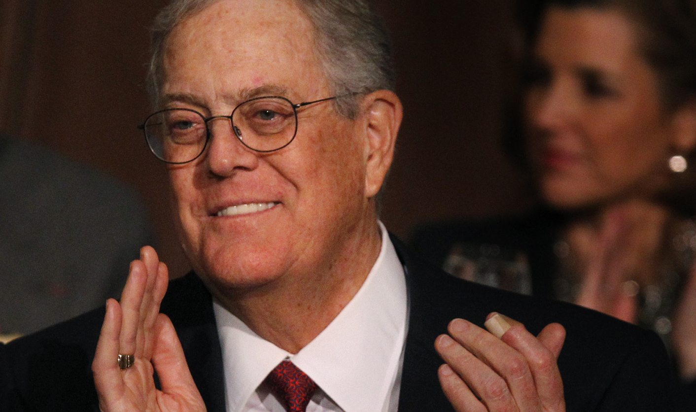 David Koch, executive vice president of Koch Industries, applauds during an Economic Club of New York event in New York