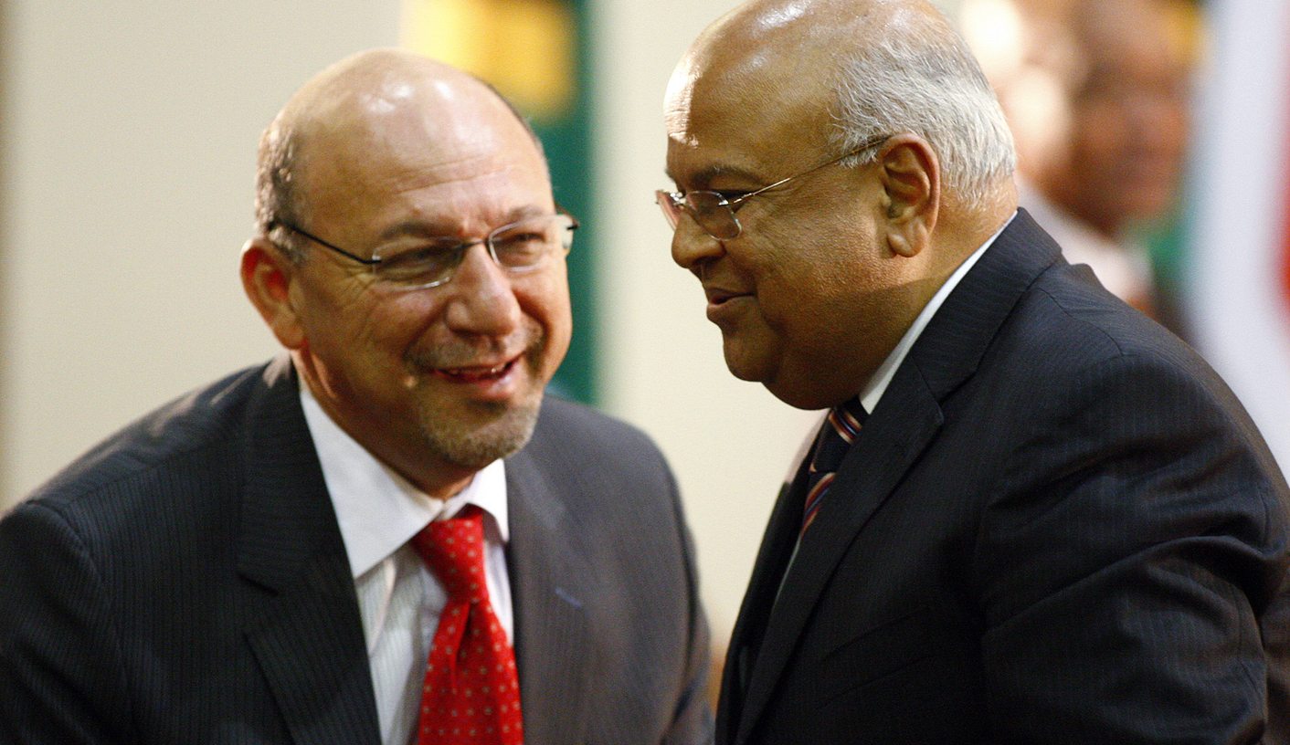 Former tax authority chief Gordhan talks with Manuel after Gordhan was sworn in as the new finance minister at the presidential guest house in Pretoria