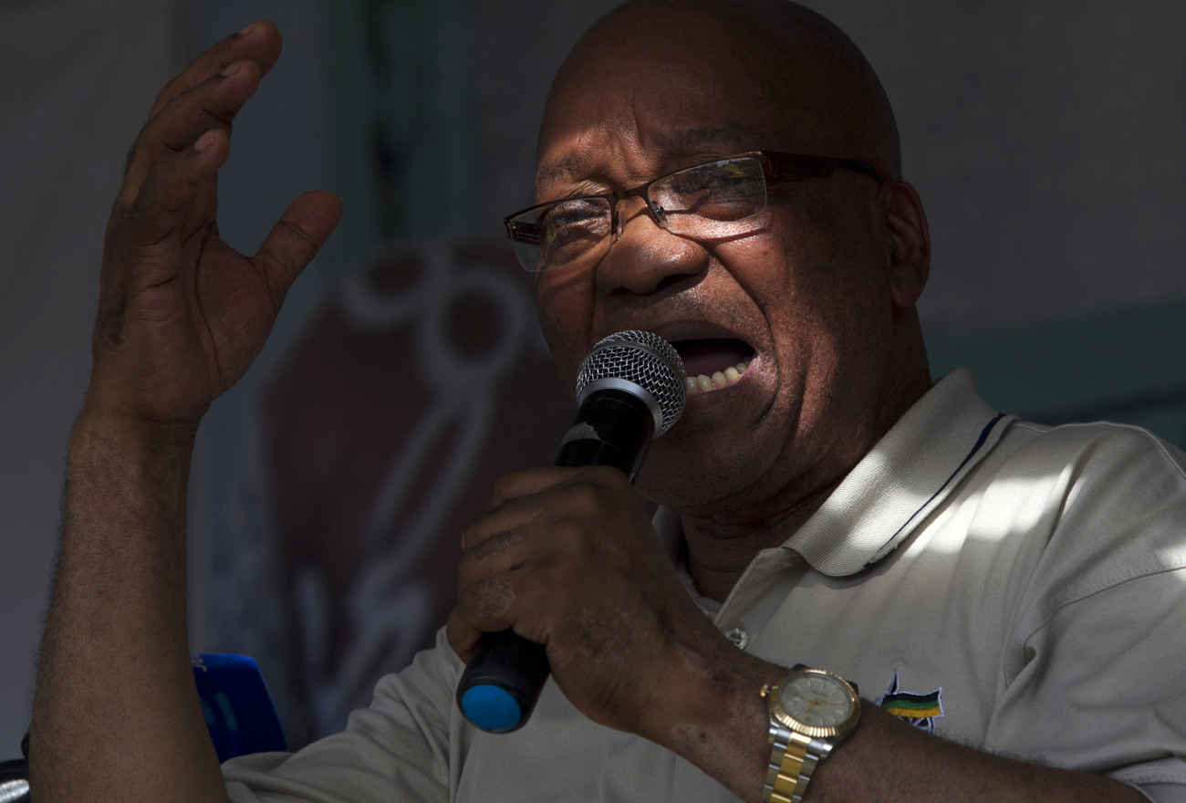 South African President Zuma sings with his supporters as he campaigns in Richmond
