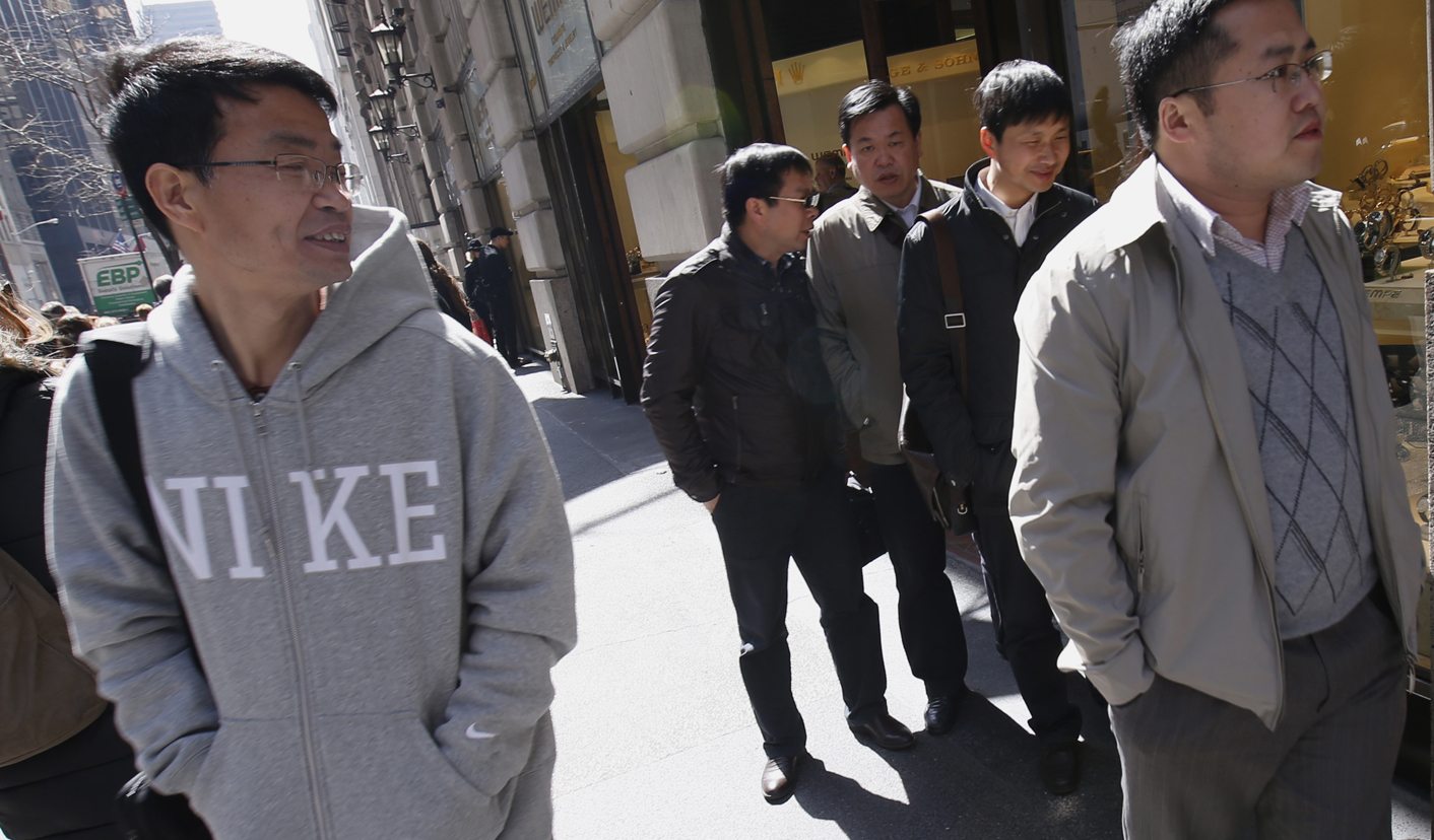 Visitors from China shop along 5th Avenue in New York City