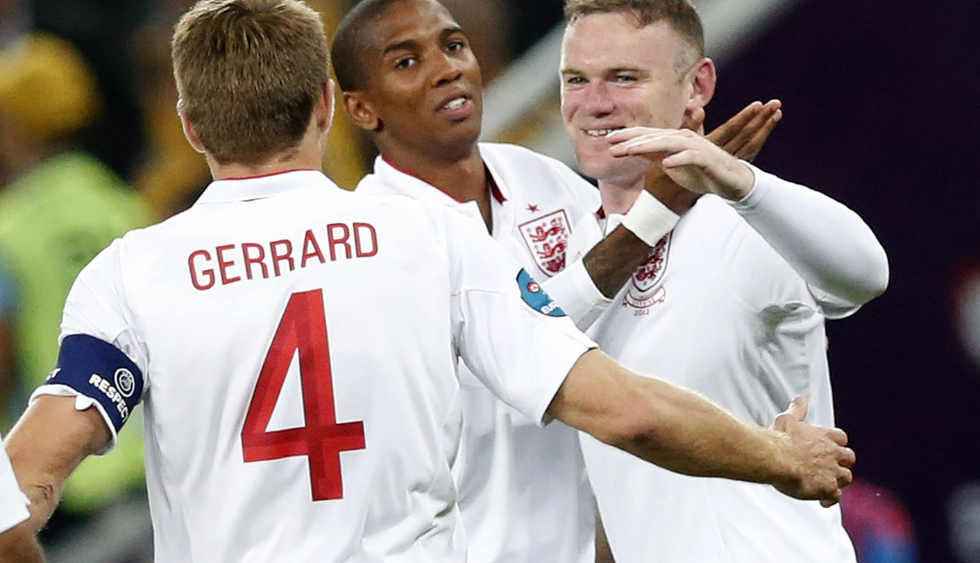 England's Rooney celebrates with his team mates Gerrard and Young after scoring a goal against Ukraine during their Group D Euro 2012 soccer match at Donbass Arena in Donetsk
