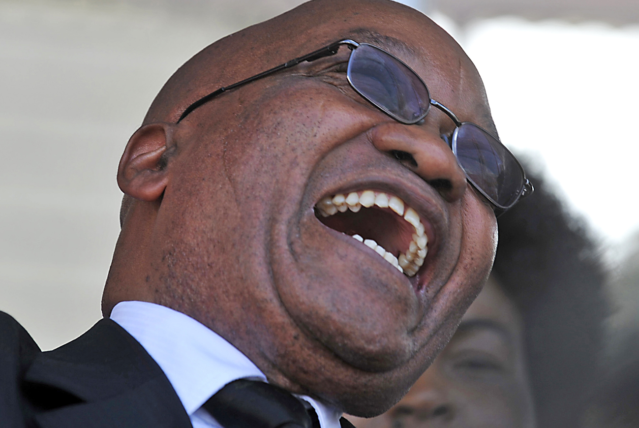 South African President Zuma laughs as he attends the swearing-in ceremony of his Mozambican counterpart Guebuza for a second term in office in the capital Maputo