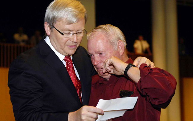 Australia's PM Rudd comforts victim after giving national apology to forgotten Australians and former child migrants in Canberra