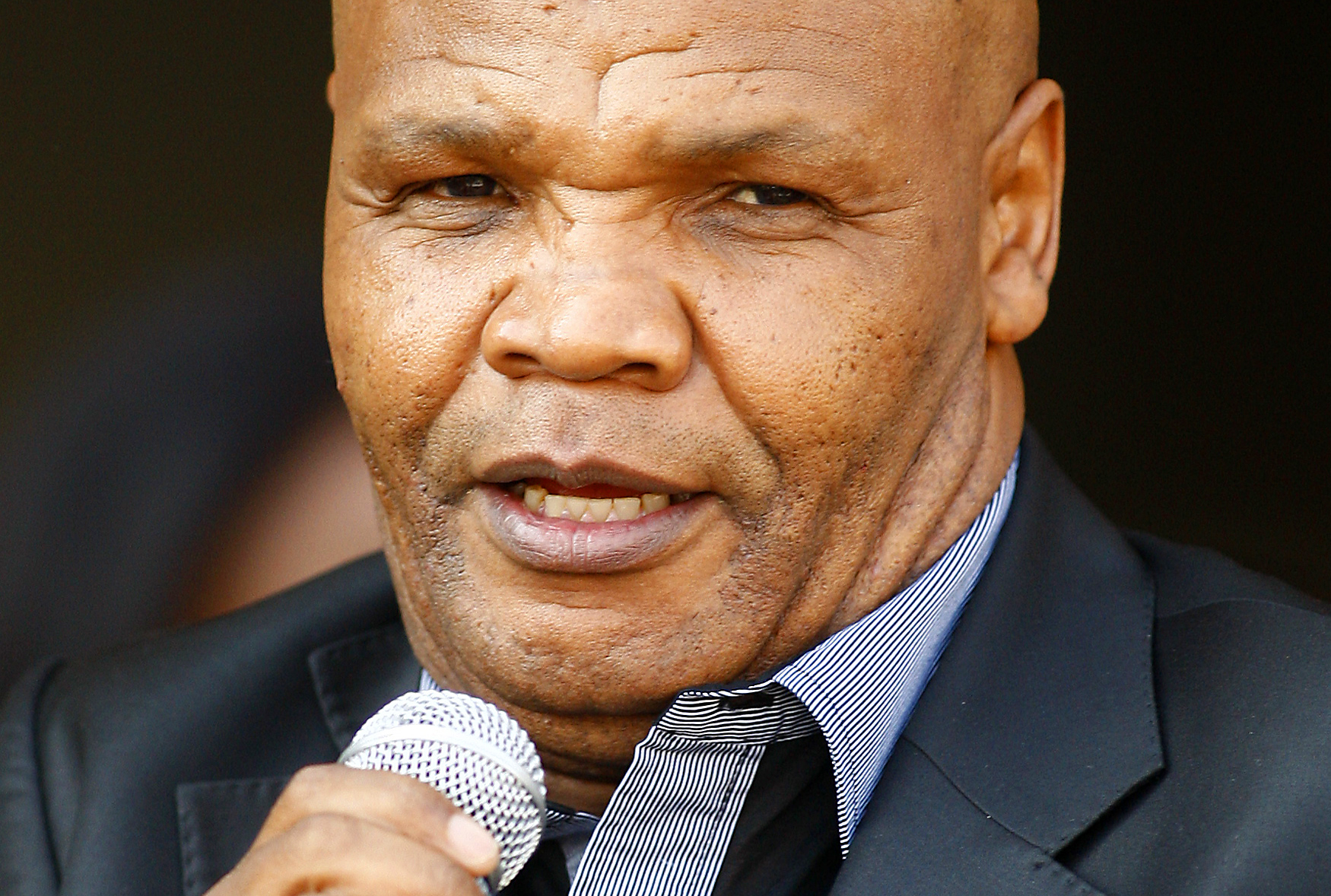 ASA President Chuene speaks to fans during the arrival of South Africa's teenage 800 metres world champion Semenya at the O.R. Tambo international airport in Johanneburg