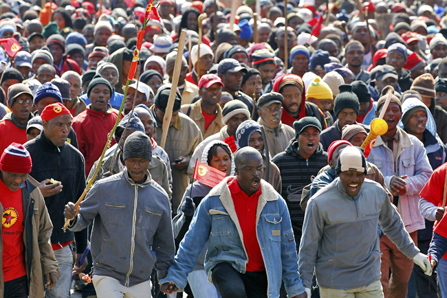 Workers take part in a march in the city of Johannesburg