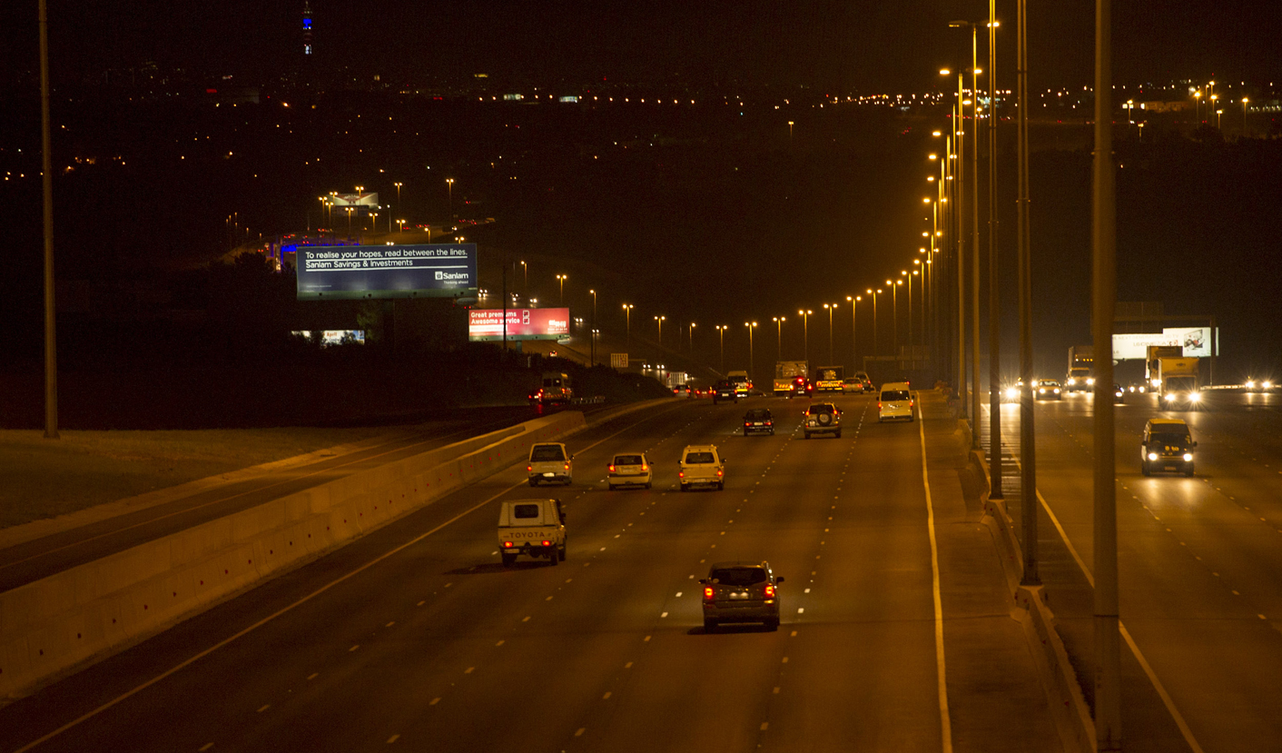 The N1 highway between Johannesburg and Pretoria, dawn. Greg Marinovich