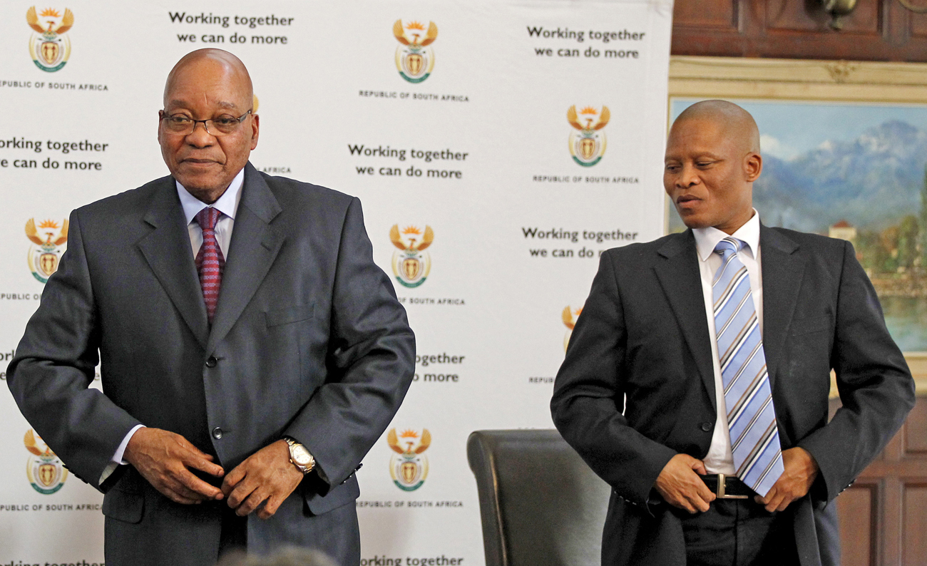 South Africa's president Jacob Zuma stands with Justice Mogoeng Mogoeng after Zuma appointed him as new Chief Justice of South Africa at presidential guest house in Pretoria