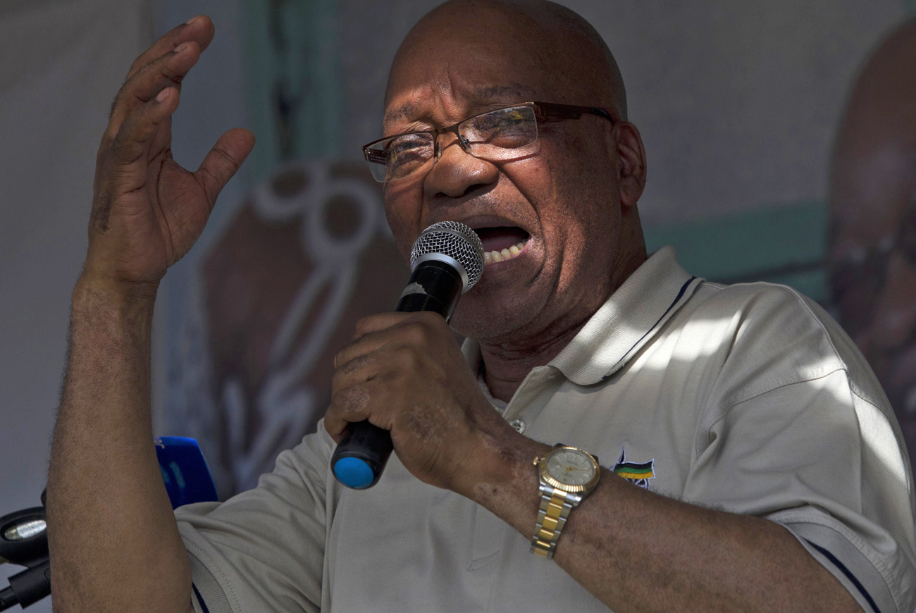 South African President Zuma sings with his supporters as he campaigns in Richmond