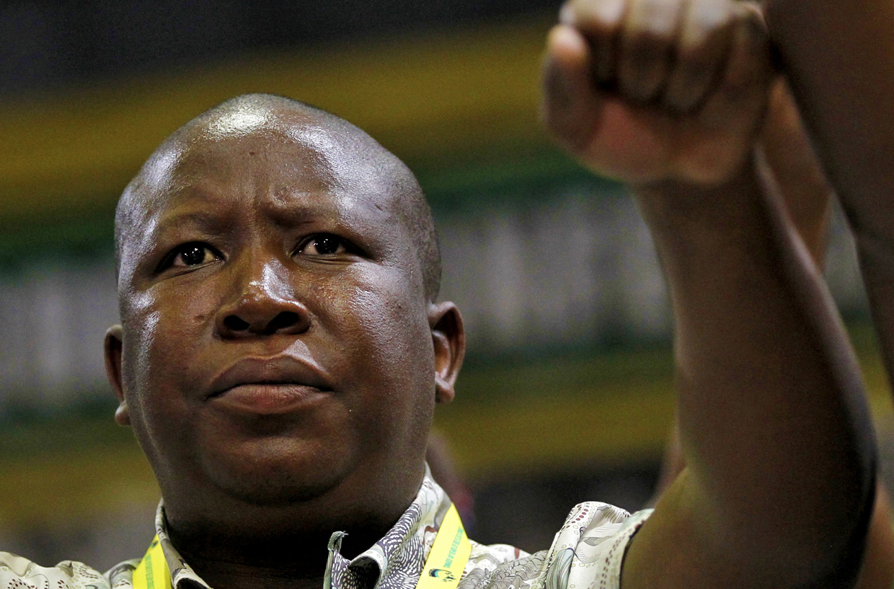 African National Congress Youth League leader Julius Malema dances as South Africa's President Jacob Zuma speaks in Durban