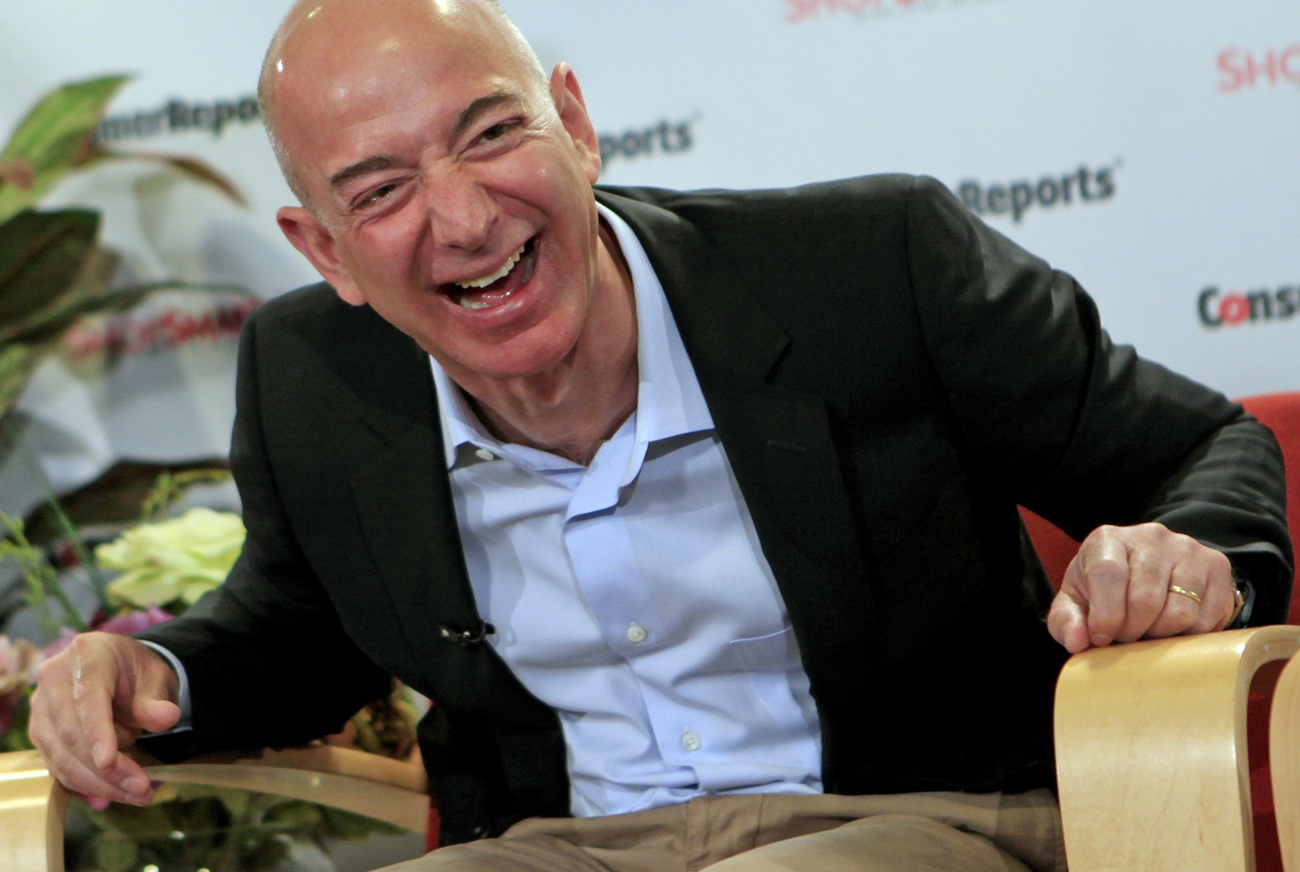 Amazon.com President, CEO and Chairman Bezos  laughs as he answers a question at the Consumer Reports headquarters in Yonkers