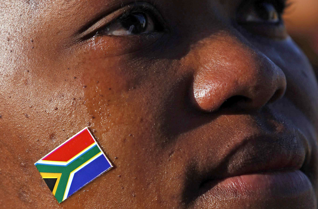 South African girl cries as she listens to her country's national anthem before start of 2010 World Cup opening match between Mexico and South Africa at fan fest in Rustenburg