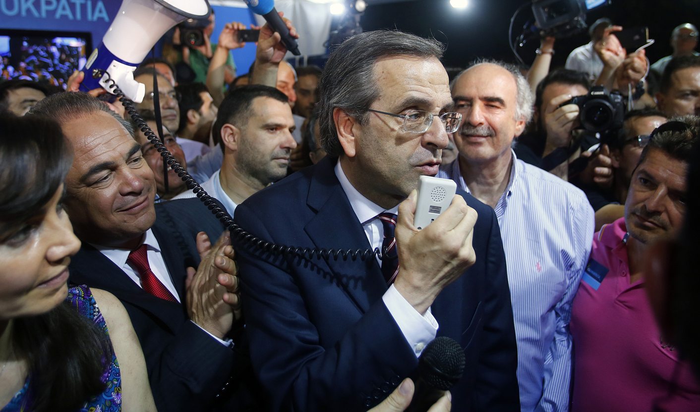 Conservative New Democracy leader Samaras addresses supporters in party's main election kiosk in Athens' Syntagma square