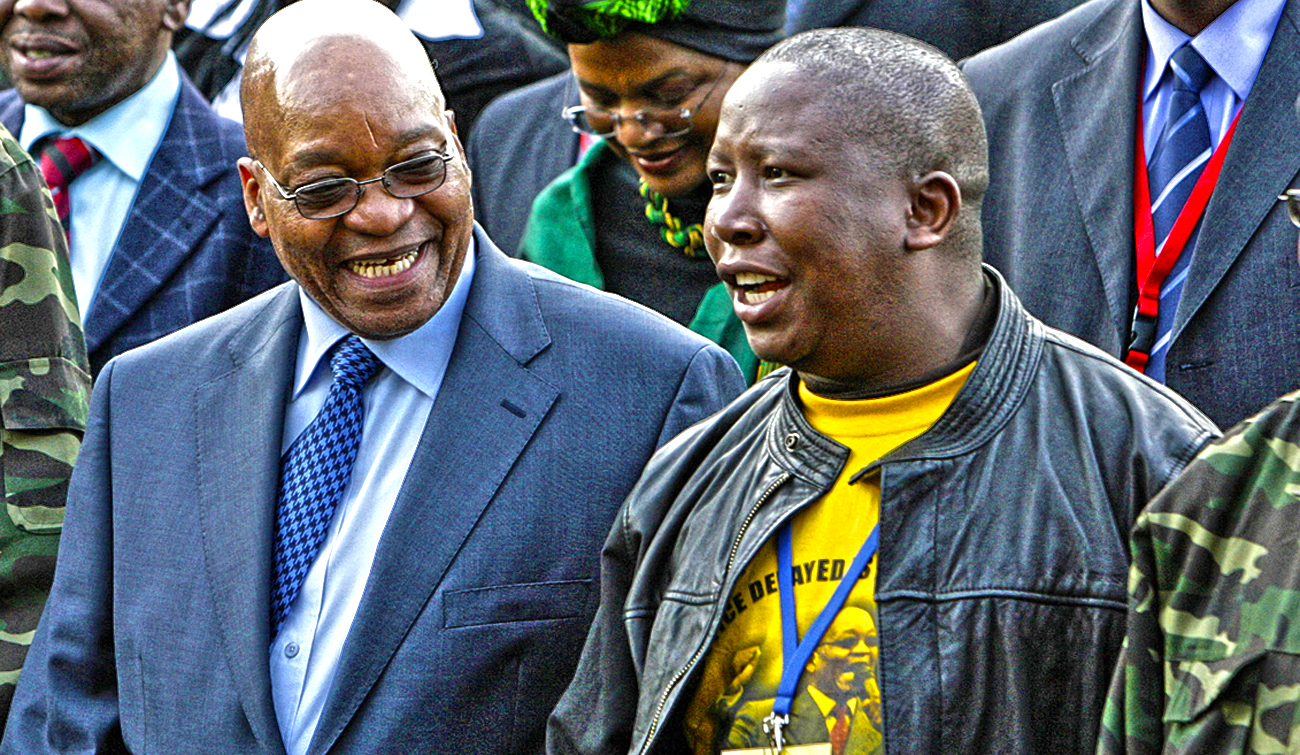 Zuma, leader of South Africa's ruling ANC, chats with Malema, president of ANCYL, at the Pietermaritzburg high court outside Durban