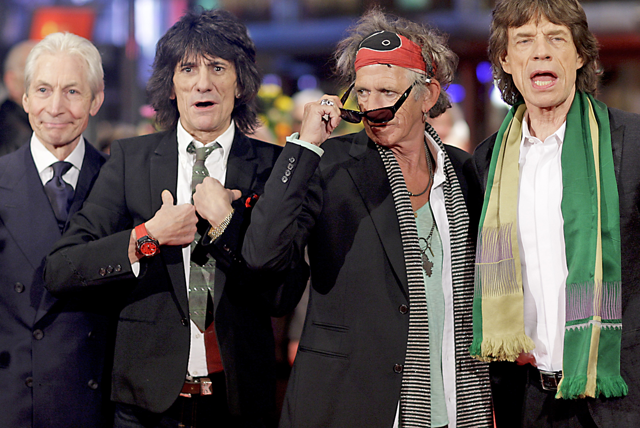 Rolling Stones members Watts, Wood, Richards and Jagger pose at the red carpet at the 58th Berlinale International Film Festival in Berlin