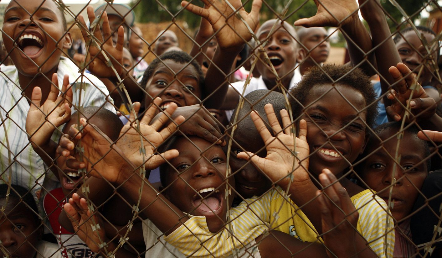 School children from Kgotlelelang wait to greet Argentina soccer coach Diego Maradona in Soshanguve