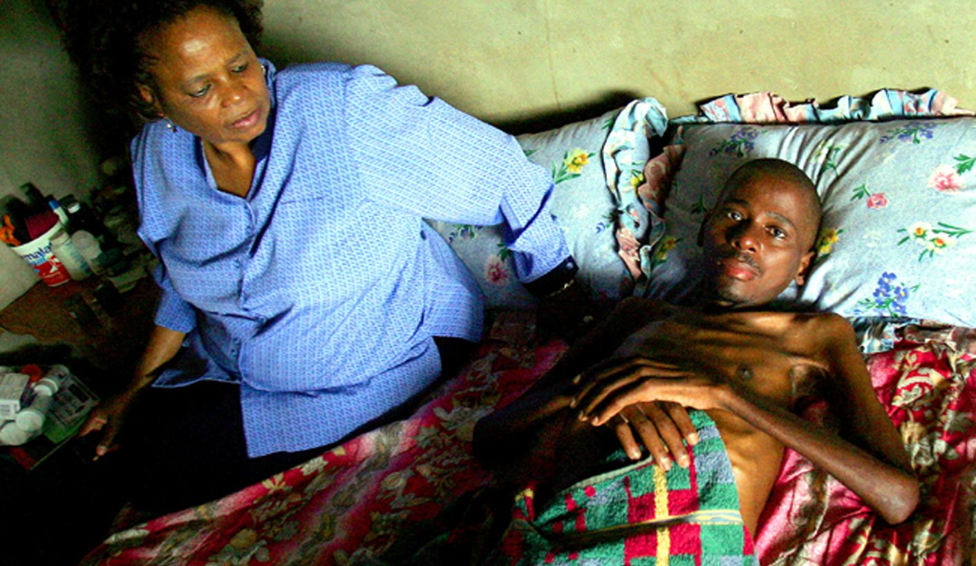 - PHOTO TAKEN 13OCT05 - Health care worker visits HIV positive Nkosinathi Mthembu at his home in Esi..