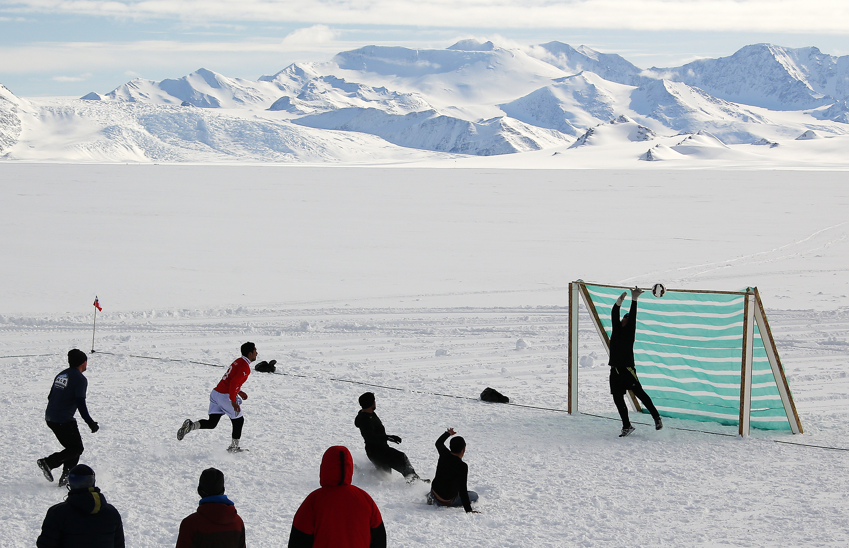 Antarctic researchers mark winter solstice with icy plunge