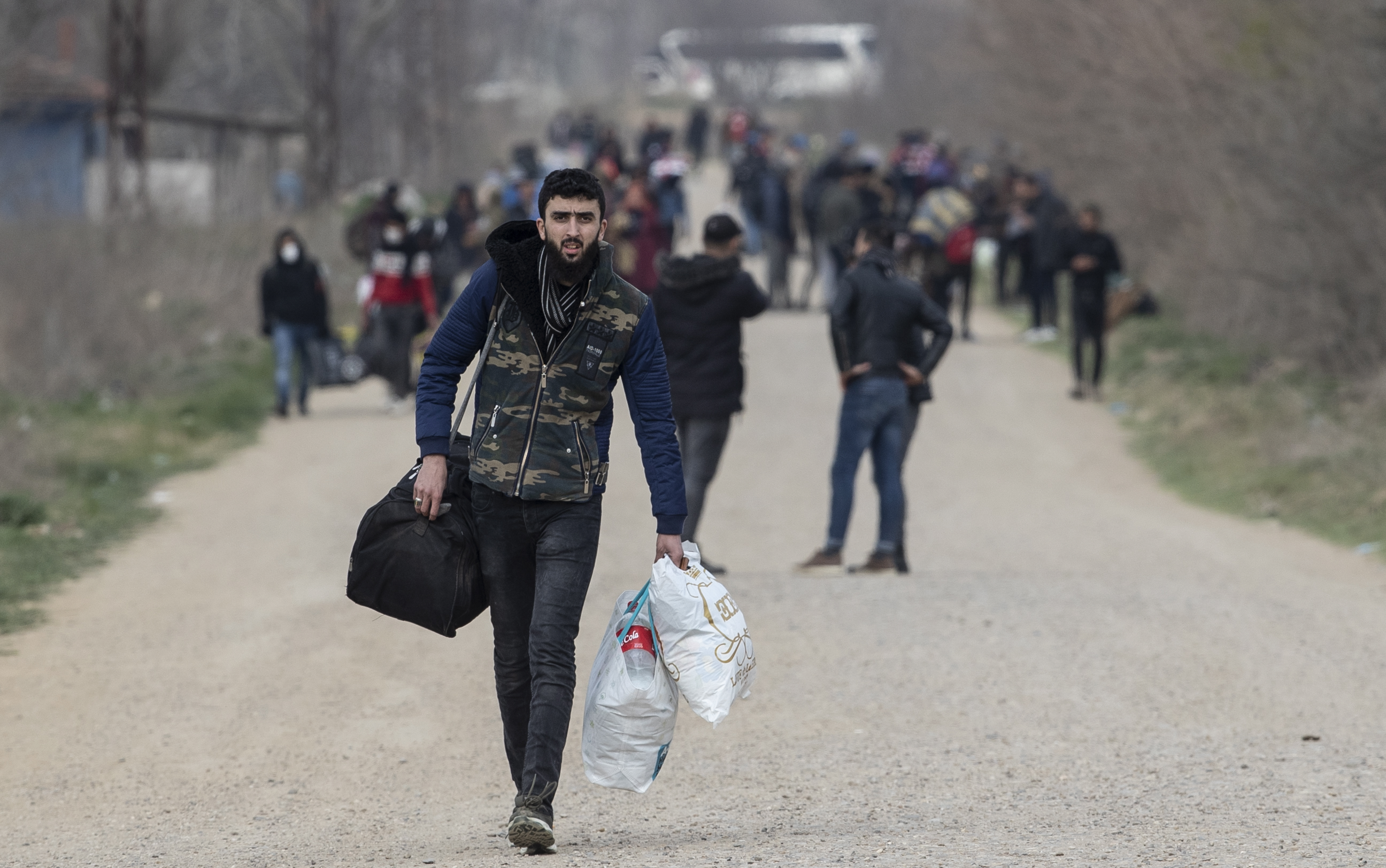 Refugees and migrants gather at the Turkish-Greek land border